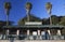 Amtrak train stop with three palm trees, Ventura, California, USA