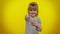 Amused funny blonde child girl pointing finger to camera, laughing out loud, funny joke, making fun