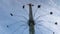 Amusement Park Carousel at the top with a blue sky in background from low angle