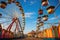 Amusement park with colorful ferris wheel and fairground rides, State Fair Carnival Midway Games Rides Ferris Wheel, AI Generated