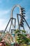 Amusement park fun, rollercoaster, upside down, loop, day, blue sky, advertising