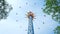 Amusement park visitors ride high colorful sky flyer