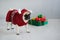 The amusing doggy of breed pug is dressed by a holiday in reindeer suit.