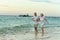 Amusing elderly couple on a beach