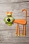 Amusing vegetable cat made on wooden board