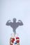 Anabolic, sports dope in bank and the image of a bodybuilder in the form of a shadow. Medical concept of abuse of doping