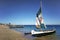 Anakao, Madagascar - May 03, 2019: Fisherman piroga small fishing boat with sail waiting at the coast on sunny day, more ships