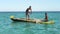 Anakao, Madagascar - May 03, 2019: View from small fishing ship sailing near shore, boat with unknown Malagasy fisher men near,