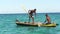 Anakao, Madagascar - May 03, 2019: View from small fishing ship sailing near shore, boat with unknown Malagasy fisher men near,