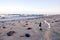 Analog aged clock face on sea beach sand