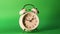 Analog clock goes on a green screen, time lapse, fast passage of time.