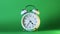 analog clock goes on a green screen, timelapse, fast passage of time.