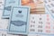 Anapa, Russia - 29.06.2020: In the background of the calendars is a bundle of five-thousandth bills and savings books