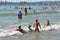 Anapa, Russia, July, 18, 2018. A lot of people on the city beach of the Black sea in Anapa. Children swimming in the waves near th