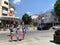 Anapa, Russia, July. 23, 2019. Grandmother with her granddaughters crossing Grebenskaya street  on pedestrian crossing in Anapa