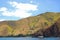 Anawangin wooden boat with mountain view in San Antonio, Zambales