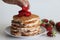 Ancakes. Soft and fluffy Buttermilk pancakes with fresh strawberries made with fresh cut strawberries added to the batter made of