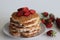 Ancakes. Soft and fluffy Buttermilk pancakes with fresh strawberries made with fresh cut strawberries added to the batter made of