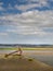 The anchor at Appledore, north Devon, yarn-bombed with colourful yarn. June 2022.