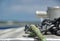 Anchor chain and rope on the front of boat with anchoring point in the background