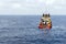 An anchor handling tug boat maneuvering at offshore oil field