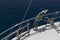 Anchor and stairs on board the yacht, white deck, blue sea