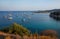 Anchored sailboats off the coast of Kastos island, Ionian sea, Greece in summer.