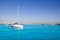 Anchored sailboats in turquoise Formentera beach