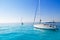 Anchored sailboats in turquoise Formentera beach