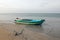 Anchored small fishing boat on Nilaveli beach in Trincomalee Sri Lanka