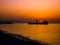Anchored Transport Ship In The Sunset