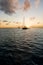 Anchoring ships in tropical bay at sunset. Small yachts and catamarans on sea water during dusk. Santa Lucia.