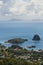 Anchoring ships in tropical bay. Yachts on blue sea water, green trees, sky and clouds. Aerial view of Kingstown and Young Island