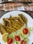 Anchovies battered with flour and fried with lettuce and tomato