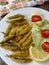 Anchovies battered with flour and fried with lettuce and tomato