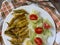 Anchovies battered with flour and fried with lettuce and tomato