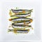 Anchovies marinated in olive oil, cooked at a low temperature.