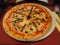 Anchovy and olive pizza for lunch in a French bistro