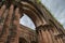 ancien ruin of bulding arch with eroded brick pillars