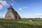 Ancient 13th Century derelict church in vibrant blue sky Summer