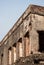 Ancient abandoned brick structural building under the cloudy sky