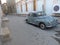 Ancient american blue car in a street of Bukhara in Uzbekistan.