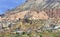 Ancient antique caves and modern settlements in the red valley of Cappadocia, central Turkey