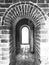 Ancient arch in China, old brick wall and floor texture in b/w.