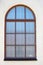 Ancient arched red window reflecting blue sky in frosted glass