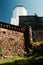 Ancient architecture concept. Tall stone wall, fortress and tower in Vyborg, Russia in sunny summer day