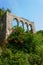 Ancient archs with flowering shrubs