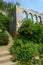 Ancient archs and stairs with flowering shrubs