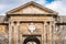 Ancient archway and medallion over door with stone columns