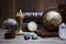 Ancient astrology. Old astrology globe and books with lighting candle